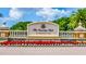 Elegant entrance sign for The Country Club at Lakewood Ranch, adorned with colorful flowers and lush greenery at 13635 Legends Walk Ter, Lakewood Ranch, FL 34202