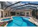 Sparkling swimming pool with a jacuzzi and screened-in lanai for year-round enjoyment at 13635 Legends Walk Ter, Lakewood Ranch, FL 34202