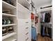 Bright walk-in closet with custom shelving and drawer storage at 13635 Legends Walk Ter, Lakewood Ranch, FL 34202