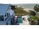 Impressive elevated coastal home with a private pool and spa overlooking the beach and ocean at 137 Big Pass Ln, Sarasota, FL 34242
