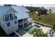 Beautiful elevated coastal home with a private pool and spa overlooking the water and nearby beach at 137 Big Pass Ln, Sarasota, FL 34242