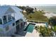 Wonderful elevated coastal home with a private pool and spa overlooking the beautiful shoreline and ocean at 137 Big Pass Ln, Sarasota, FL 34242
