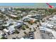 Aerial view of the town, beach, and property indicated with a red arrow at 137 Big Pass Ln, Sarasota, FL 34242
