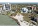 Aerial view of a beachfront property, showcasing its proximity to the water and the surrounding neighborhood at 137 Big Pass Ln, Sarasota, FL 34242