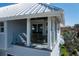 Outdoor balcony featuring glass railings and serene views at 137 Big Pass Ln, Sarasota, FL 34242