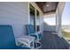 Relax on the balcony featuring comfortable chairs and a serene view of the ocean at 137 Big Pass Ln, Sarasota, FL 34242