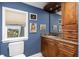 Bathroom featuring granite countertop, vanity with storage, mirror, and window for natural light at 137 Big Pass Ln, Sarasota, FL 34242