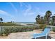 Scenic beach view from a cozy outdoor seating area, perfect for enjoying coastal breezes at 137 Big Pass Ln, Sarasota, FL 34242