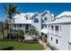 Striking exterior shot of two story home showcasing architecture, curb appeal and front door at 137 Big Pass Ln, Sarasota, FL 34242