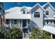 Up close exterior shot of two story home showcasing architecture, curb appeal and front door at 137 Big Pass Ln, Sarasota, FL 34242