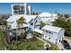 Stunning exterior shot of two story home showcasing architecture, curb appeal and balcony at 137 Big Pass Ln, Sarasota, FL 34242