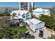 Stunning exterior shot of two story home showcasing architecture, curb appeal and balcony at 137 Big Pass Ln, Sarasota, FL 34242