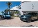 Beautiful exterior shot of home and garage, showcasing curb appeal and brick driveway at 137 Big Pass Ln, Sarasota, FL 34242