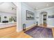 Open foyer featuring hardwood floors, an art gallery, and access to the living room at 137 Big Pass Ln, Sarasota, FL 34242