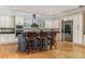 Open kitchen with stylish island, bar stool seating, and stainless steel appliances at 137 Big Pass Ln, Sarasota, FL 34242