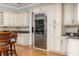 Bright, open kitchen featuring a built-in refrigerator and breakfast bar seating at 137 Big Pass Ln, Sarasota, FL 34242