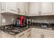 Kitchenette featuring stone counters, stainless steel sink, and modern cabinetry at 137 Big Pass Ln, Sarasota, FL 34242