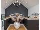 Stylish landing with hardwood floors, unique decor, and elegant lighting fixture at 137 Big Pass Ln, Sarasota, FL 34242