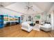 Beautiful living room with hardwood floors, a stone fireplace, and modern decor with an open floor plan at 137 Big Pass Ln, Sarasota, FL 34242
