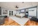 Large main bedroom featuring a ceiling fan, wood floors, and a door leading to a balcony, and recessed lighting at 137 Big Pass Ln, Sarasota, FL 34242