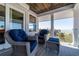Inviting outdoor patio with comfortable seating and stunning waterfront views, perfect for relaxing and entertaining at 137 Big Pass Ln, Sarasota, FL 34242