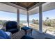 Outdoor patio with ample seating, featuring clear views of waterfront and nearby coastline and greenery at 137 Big Pass Ln, Sarasota, FL 34242