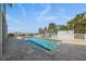 Outdoor pool with tile surround, featuring multiple access points, in a backyard with a partial ocean view at 137 Big Pass Ln, Sarasota, FL 34242