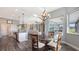 Open concept dining room with backyard views, seamless integration with the kitchen and living area at 13904 Gettis Lee Rd, Parrish, FL 34219