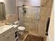Updated bathroom with shower including tile surround and glass doors, along with modern fixtures at 1534 25Th St, Sarasota, FL 34234