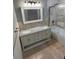 Bathroom featuring a double sink vanity, framed mirror, and a shower/tub combo at 1534 25Th St, Sarasota, FL 34234