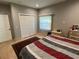 Bedroom featuring neutral walls, tile floors, closet and window, creating a cozy and inviting space at 1534 25Th St, Sarasota, FL 34234