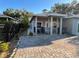 Charming single-story home featuring a covered front porch and beautiful paver driveway at 1534 25Th St, Sarasota, FL 34234