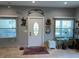 Light-filled foyer featuring tile floors, decorative accents, and a stylish front door at 1534 25Th St, Sarasota, FL 34234
