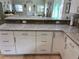 Kitchen featuring white cabinets, granite countertops, and stainless steel appliances at 1534 25Th St, Sarasota, FL 34234