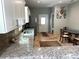 Kitchen area featuring white cabinets and countertops with a breakfast table in the background at 1534 25Th St, Sarasota, FL 34234