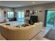 Spacious living room with ample natural light, complemented by travertine tile flooring and comfortable seating at 1534 25Th St, Sarasota, FL 34234