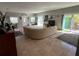 Spacious living room with tile flooring, slider door, and comfortable seating area, perfect for relaxation at 1534 25Th St, Sarasota, FL 34234