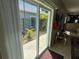 Bright living room with sliding glass doors open to an outdoor patio at 1534 25Th St, Sarasota, FL 34234