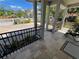 View of the patio with tile flooring, columns, and iron fencing, offering a relaxing outdoor space at 1534 25Th St, Sarasota, FL 34234