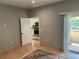 Room with tile floors, slider, and doorway to updated kitchen with stainless appliances at 1534 25Th St, Sarasota, FL 34234