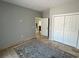 Room with tile floors and neutral paint, featuring a closet and doorway leading into the living area at 1534 25Th St, Sarasota, FL 34234