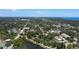Expansive aerial view of a city with abundant greenery, showcasing its parks, streets, and the skyline in the distance at 1704 Ballard Park Dr, Bradenton, FL 34205