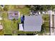 Aerial view of home, showing the light blue siding, fenced yard, and neighborhood surroundings at 1704 Ballard Park Dr, Bradenton, FL 34205