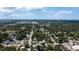 Extensive aerial view shows the overall city with lush foliage and clear blue skies above at 1704 Ballard Park Dr, Bradenton, FL 34205