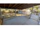 Enclosed porch with gray painted wood and screened windows over looking the backyard at 1704 Ballard Park Dr, Bradenton, FL 34205