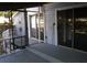 Enclosed porch with gray painted wood, screened windows and sliding glass door access at 1704 Ballard Park Dr, Bradenton, FL 34205