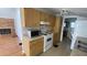 Functional kitchen with essential appliances and cabinetry, connecting to the adjacent living area at 1704 Ballard Park Dr, Bradenton, FL 34205