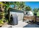 Backyard area with shed, grill, and seating, perfect for outdoor entertaining and relaxation at 1739 Oak St, Sarasota, FL 34236