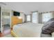 This bright bedroom features neutral walls, light wood furniture, and lots of natural light at 1739 Oak St, Sarasota, FL 34236