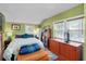 Cozy bedroom with an abundance of natural light from two windows at 1739 Oak St, Sarasota, FL 34236